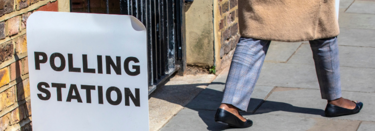 Someone walks away from a polling station